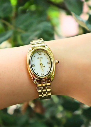 IEKE Xerxes – Montre dorée au charme intemporel & cadran blanc raffiné
