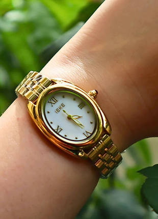 IEKE Xerxes – Montre dorée au charme intemporel & cadran blanc raffiné